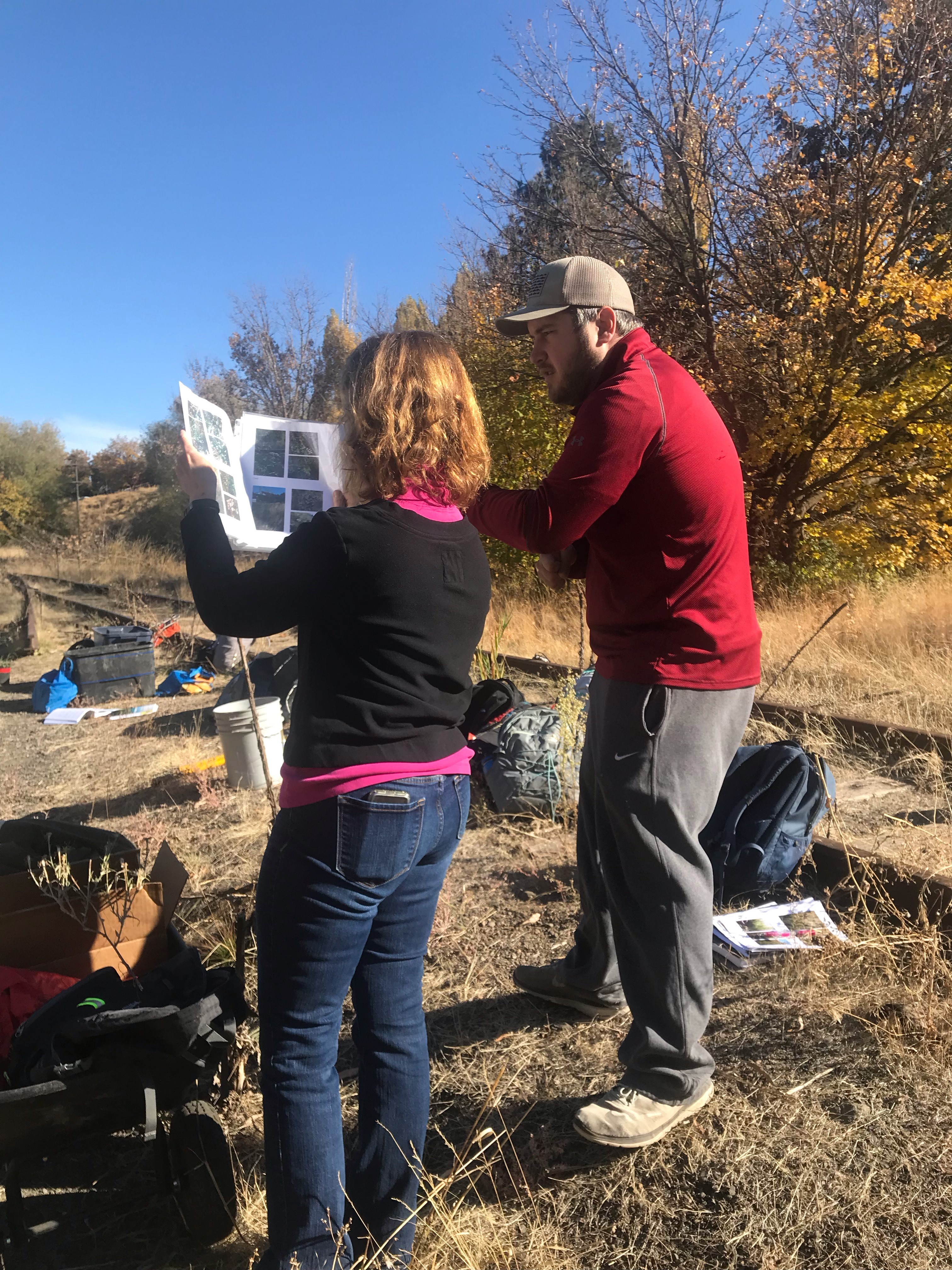 WSU SOE undergraduate student and a member of Palouse Civic Trust identify invasive plants along the Missouri Flat Creek.